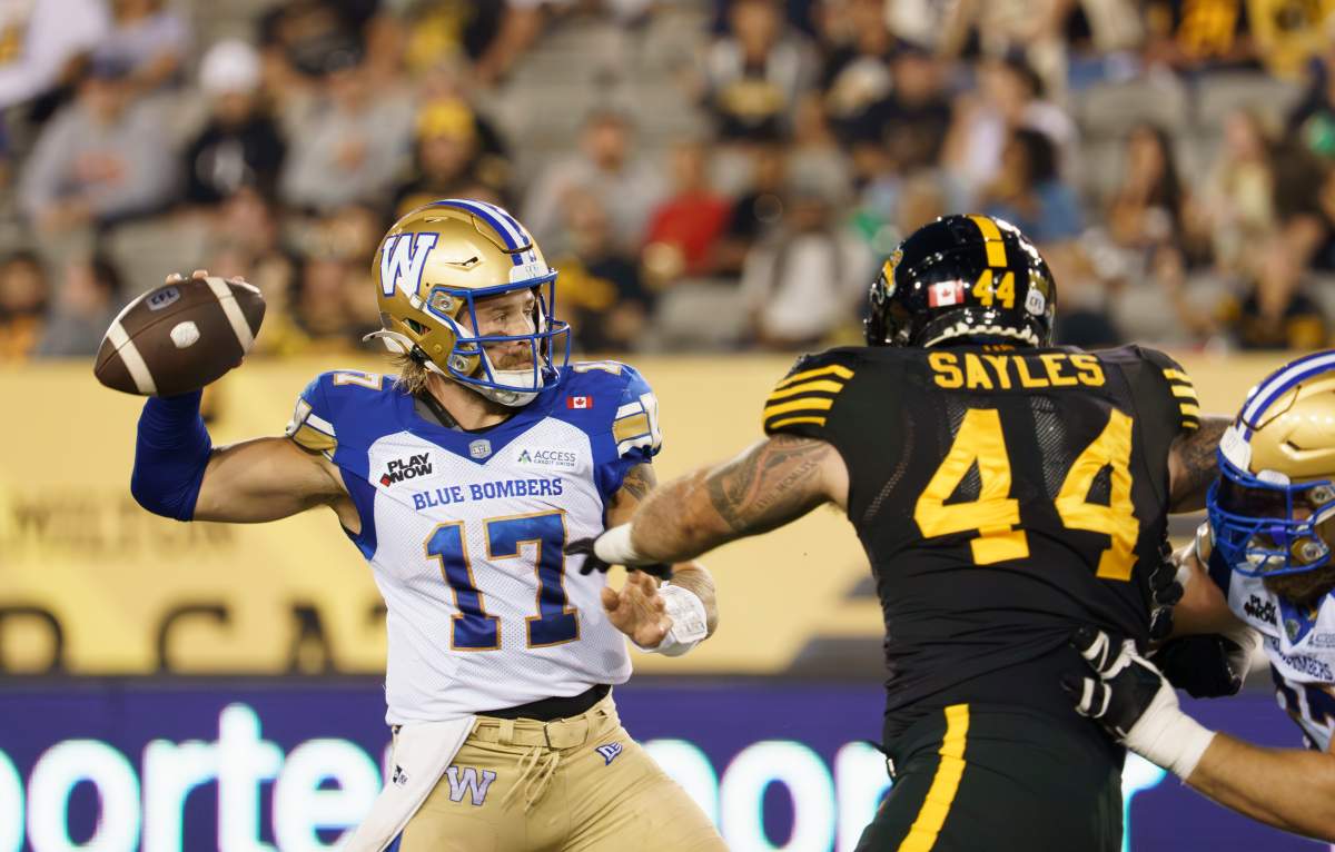 Winnipeg Blue Bombers quarterback Chris Streveler (17) throws during first half CFL football game action against the Hamilton Tiger Cats in Hamilton, Ont. on Friday, September 12, 2025. THE CANADIAN PRESS/Peter Power.