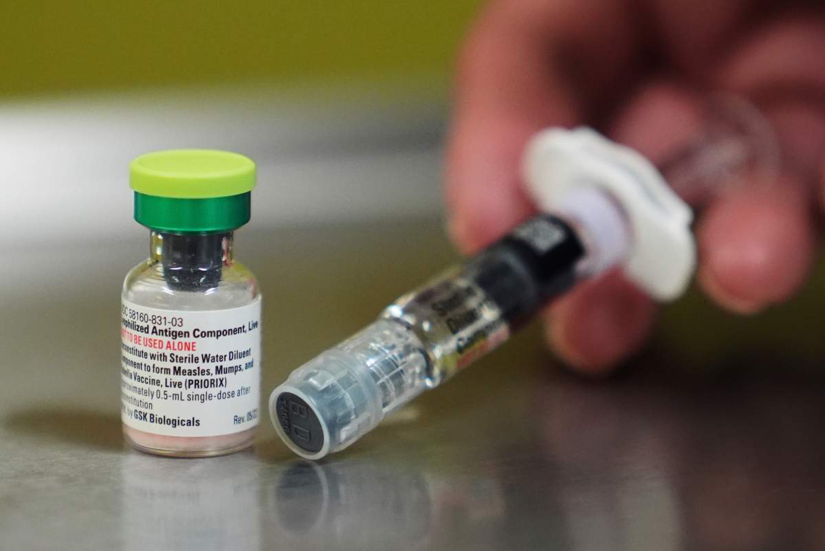 A vial of the measles, mumps and rubella (MMR) vaccine is pictured with a sterile water diluent at International Community Health Services on Sept. 10, 2025, in Seattle.