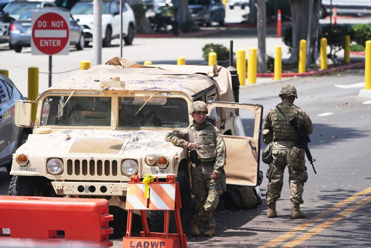 Members of the California National Guard work outside of a federal building Friday, June 13, 2025, in Los Angeles
