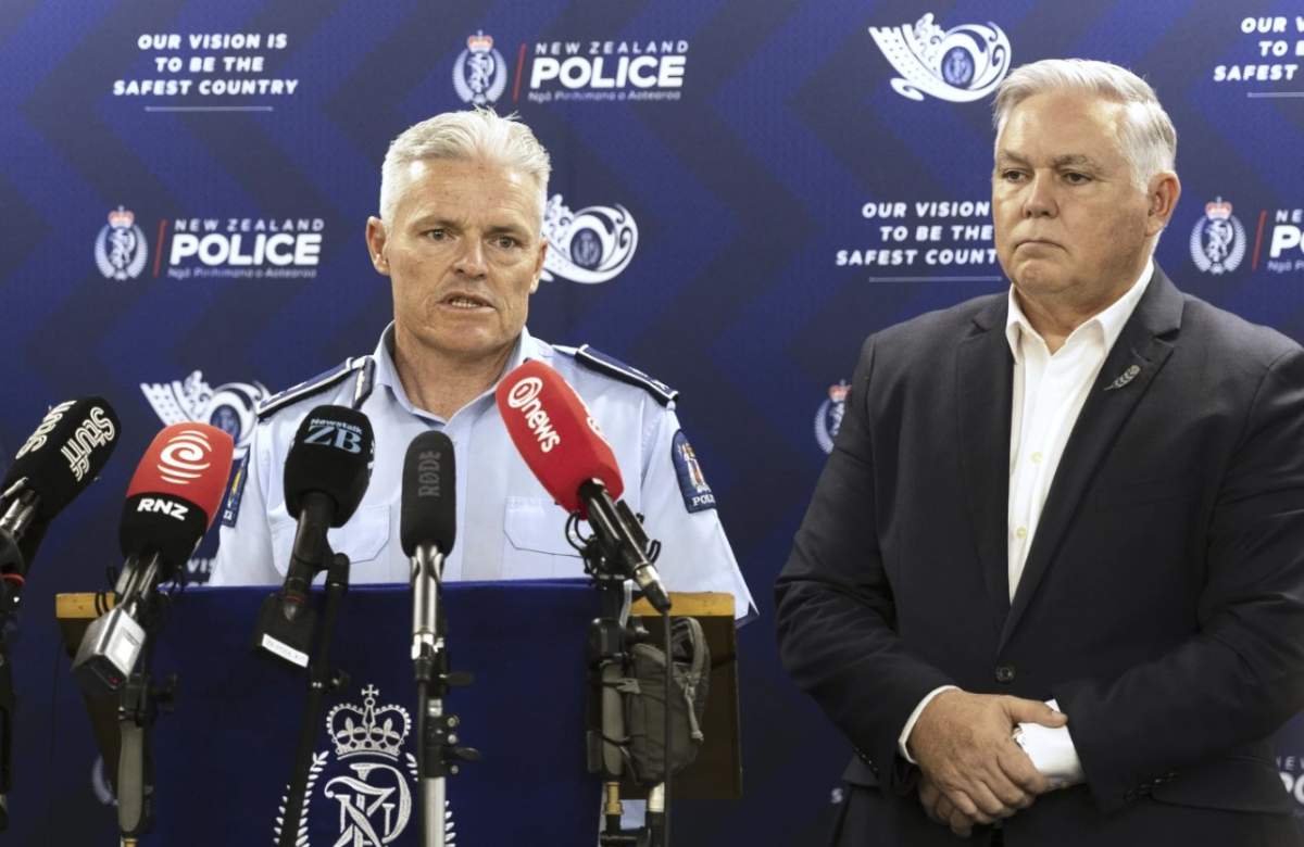 New Zealand Commissioner of Police Richard Chambers, left, and Police Minister Mark Mitchell address a press conference in Hamilton, New Zealand, Tuesday, Sept. 9, 2025.