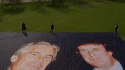A giant photo of Donald Trump and Jeffrey Epstein is unfurled outside Windsor Castle ahead of the president's state visit to the U.K.