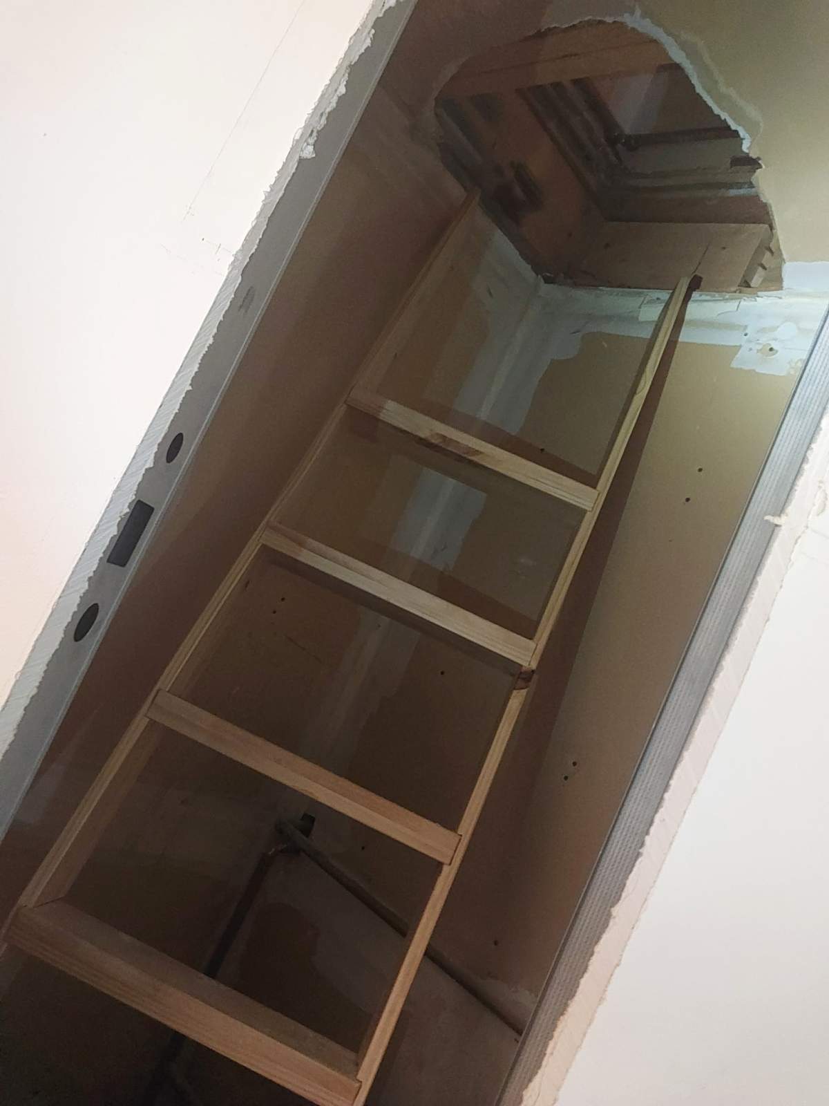 A Calgary man has been accused of tunnelling into neighbour's apartment.