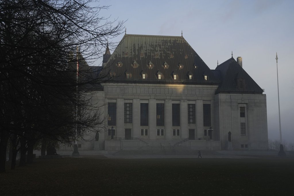 The Supreme Court of Canada building is shrouded in fog in Ottawa, on Friday, Nov. 4, 2022. THE CANADIAN PRESS/Sean Kilpatrick.