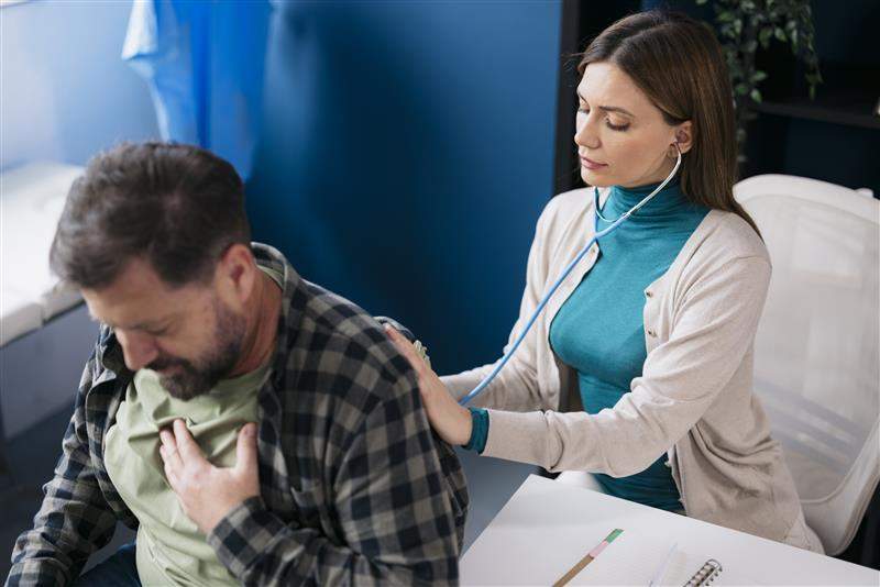 A doctor uses a stethoscope to assess a patient’s breathing. Brothers91/Getty Images