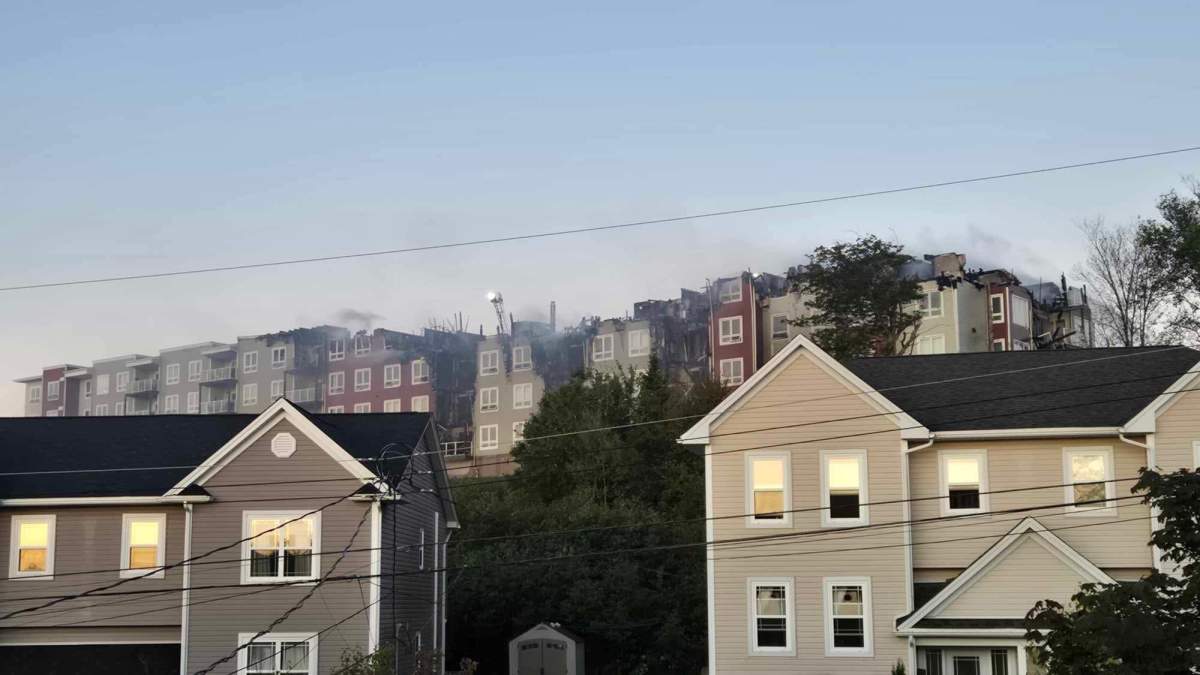 Firefighters work to put out a fire that broke out at an apartment in Sackville, N.S.