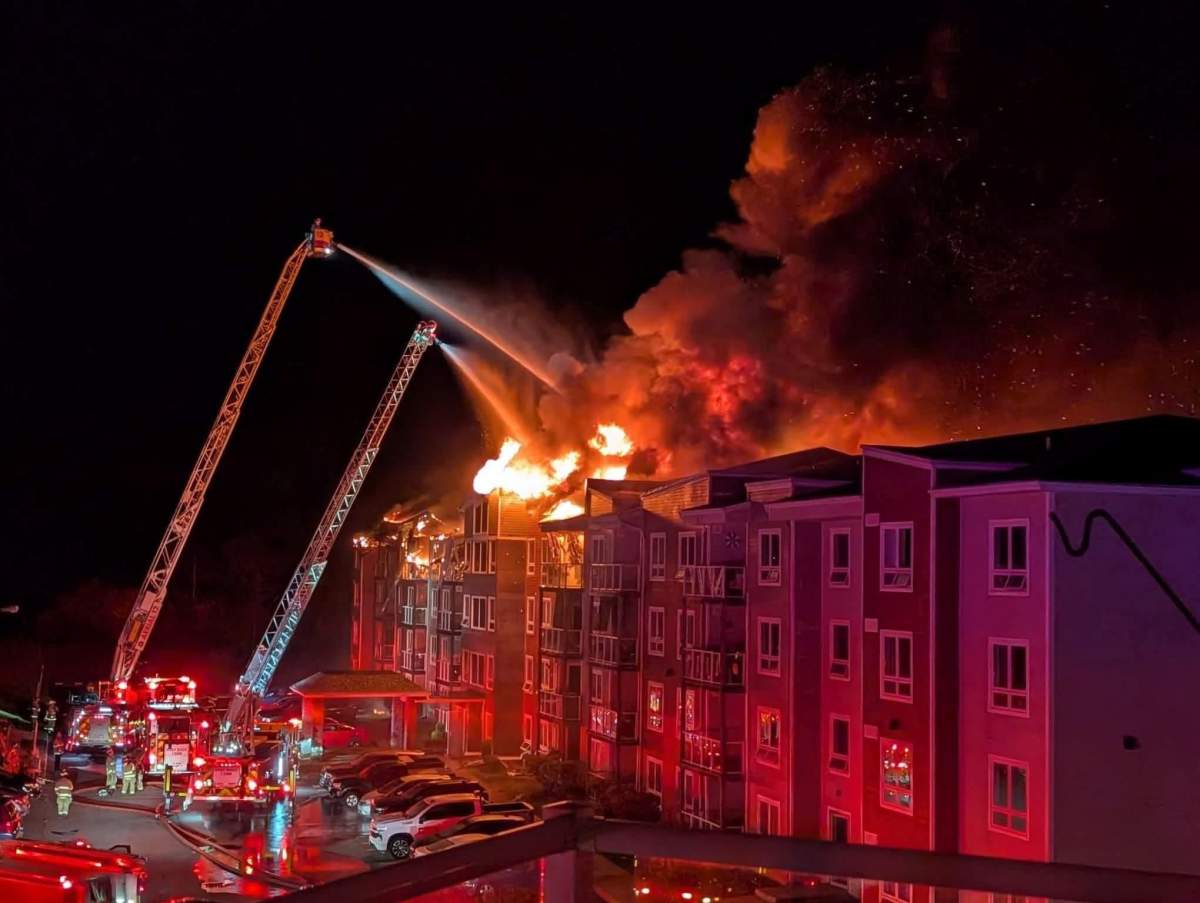 Firefighters work to put out a fire that broke out at an apartment in Sackville, N.S.