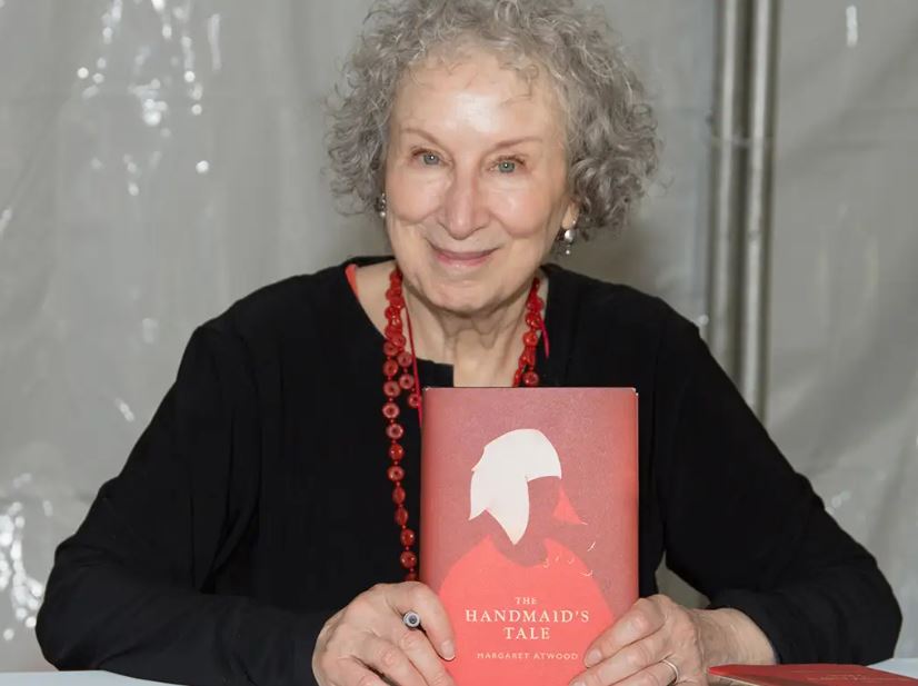 Author Margaret Atwood holding a copy of her novel 'The Handmaid's Tale,' one of the books listed by Edmonton's public school board to remove from its shelves.