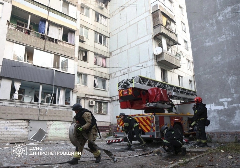 In this photo provided by the Ukrainian Emergency Services on Sept. 20, 2025, rescuers work on a site of a residential house damaged by a Russian strike on Dnipro, Ukraine.