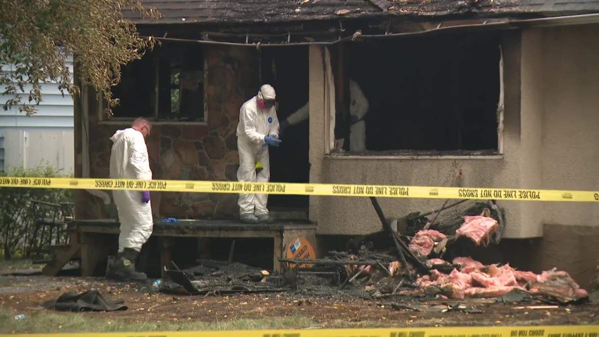 Investigators on site after a person was found dead under suspicious circumstances at a house fire near 59 Street and 119 Avenue in Edmonton's Montrose neighbourhood on Sunday, Aug. 31, 2025.