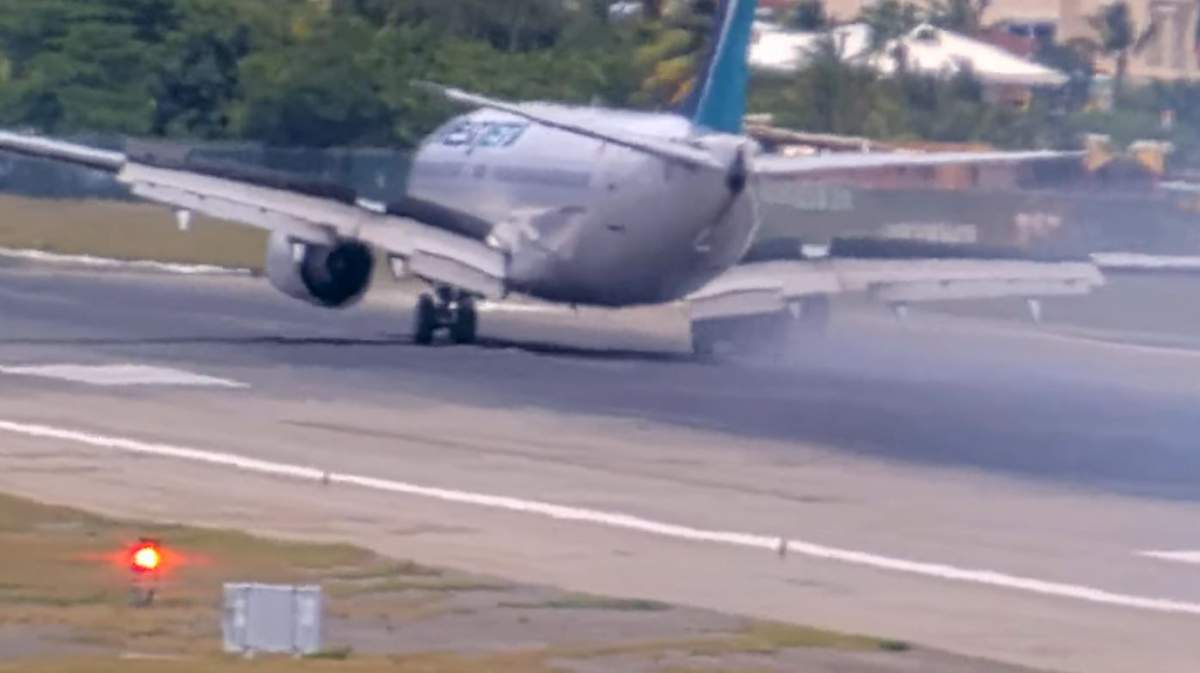 Video of the main airport in Sint Maarten, posted online, shows the WestJet plane making a hard landing before the landing gear on the right side of the plane appears to collapse.