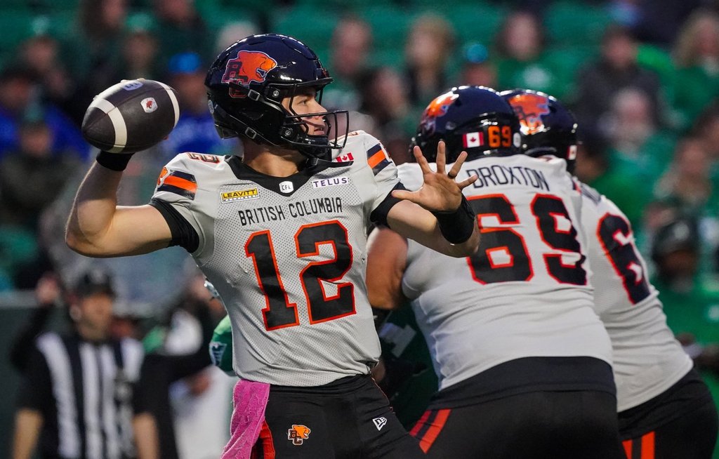 B.C. Lions quarterback Nathan Rourke (12) throws against the Saskatchewan Roughriders during the first half of CFL football action in Regina, on Saturday, Oct. 25, 2025. THE CANADIAN PRESS/Heywood Yu.