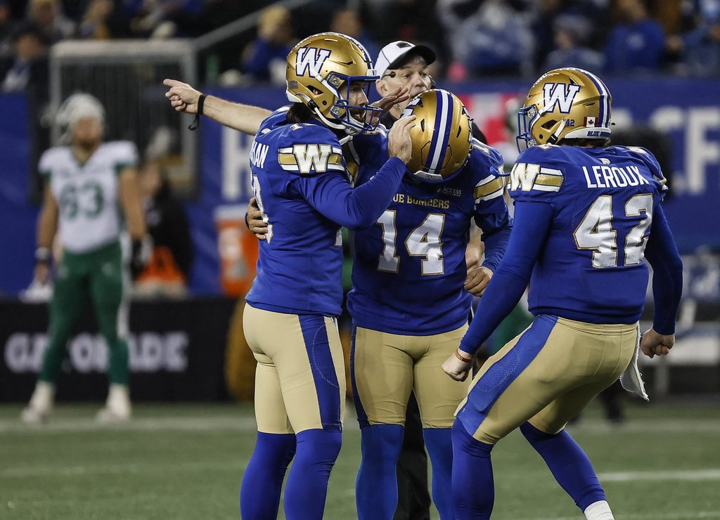 Winnipeg Blue Bombers' Jamieson Sheahan (18), kicker Sergio Castillo (14) and Ian Leroux (42) celebrate Castillo's game-winning field goal against the Saskatchewan Roughriders during second half CFL action in Winnipeg Friday, October 17, 2025.    THE CANADIAN PRESS/John Woods.
