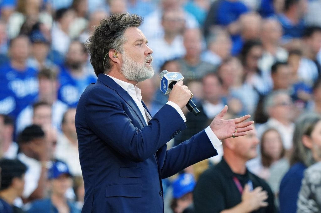 Rufus Wainwright sings the Canadian national anthem ahead of first inning Game 5 World Series playoff MLB baseball action between the Toronto Blue Jays and the Los Angeles Dodgers in Los Angeles on Wednesday, Oct. 29, 2025.