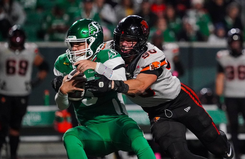 B.C. Lions defensive lineman Mathieu Betts (90) tackles Saskatchewan Roughriders quarterback Jake Maier (9) during the second half of CFL football action in Regina, on Saturday, October 25, 2025. THE CANADIAN PRESS/Heywood Yu.