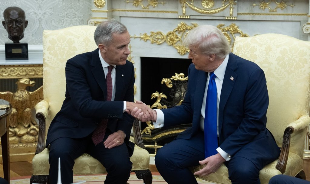 Prime Minister Mark Carney shakes hands with United States President Donald Trump at the start of a meeting in the Oval Office in the White House, in Washington, D.C. Tuesday, Oct 7, 2025 in Washington.