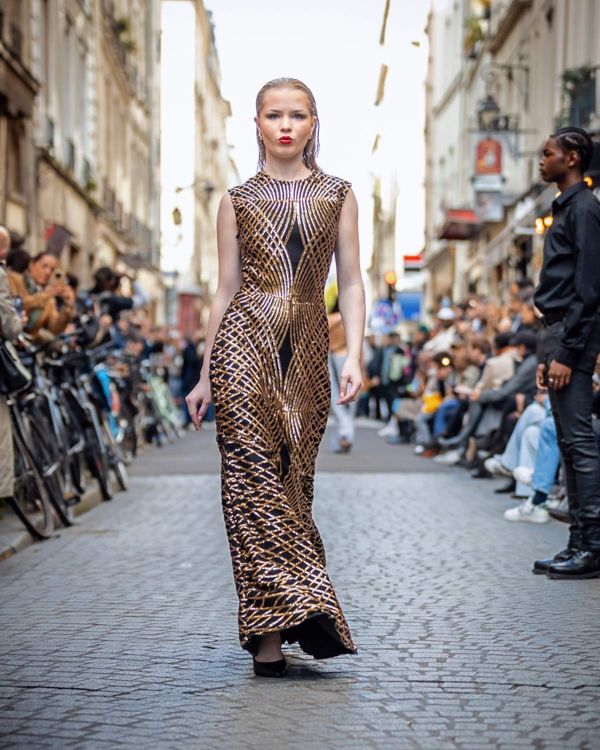 Corinne Cameron models a dress from designer John Michael Brewer in Paris during Paris Fashion Week.