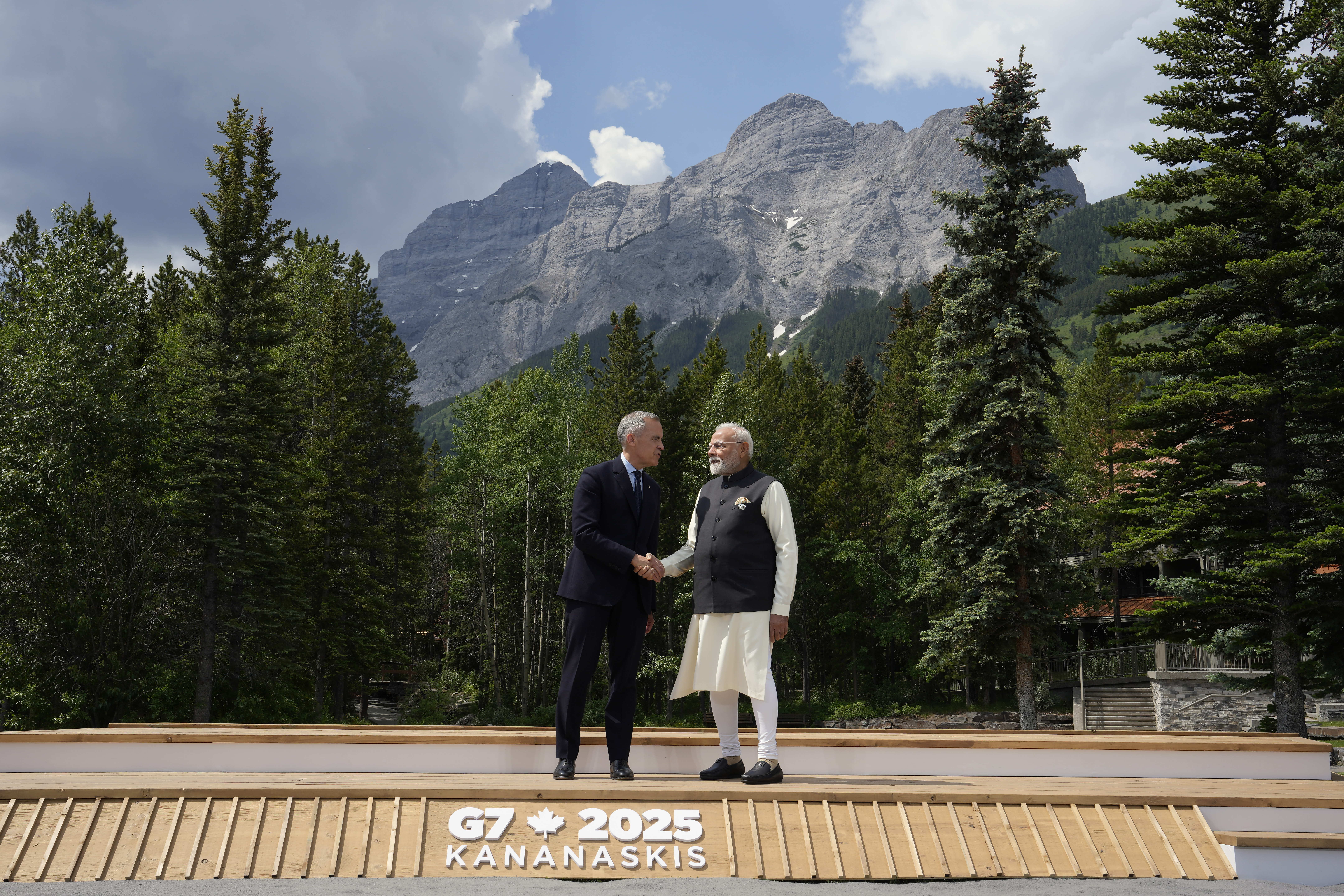 Canadian Prime Minister Mark Carney welcomes Indian Prime Minister Narendra Modi to the G7 Summit in Kananaskis, Alta., on June 17, 2025. THE CANADIAN PRESS/Adrian Wyld