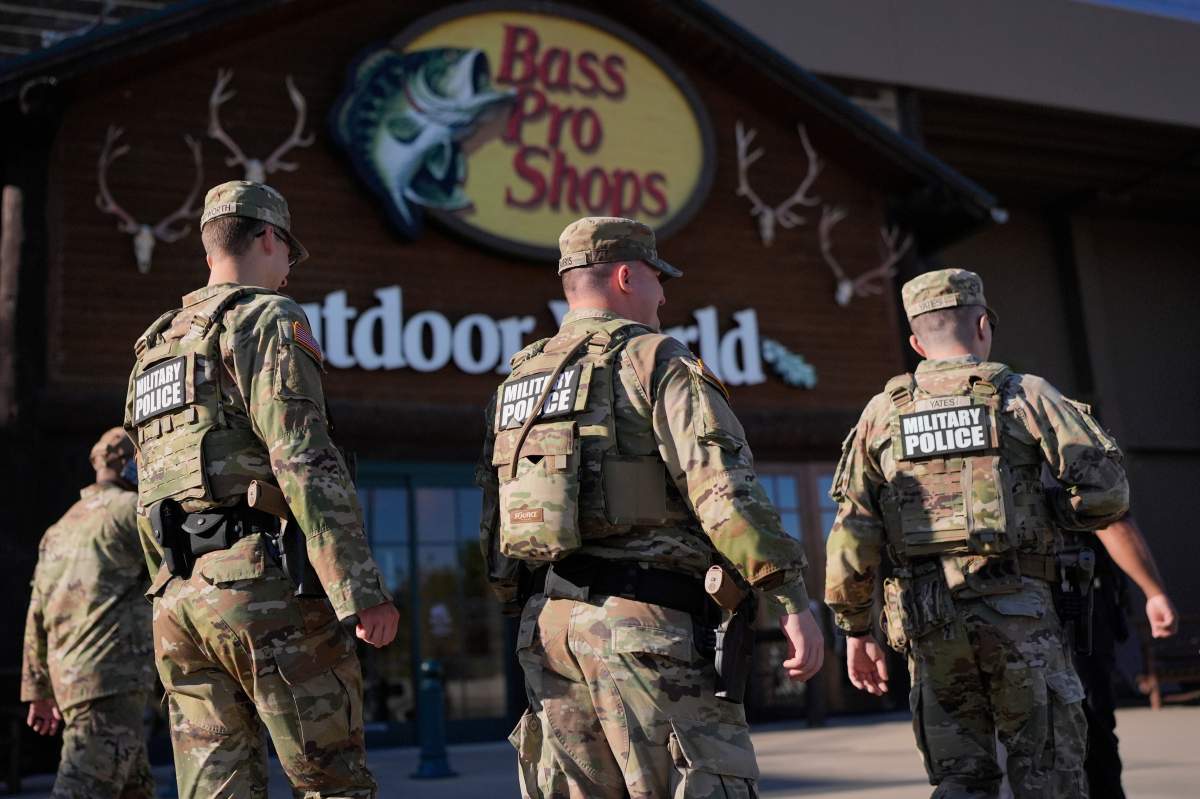 Members of National Guard patrol outside a Bass Pro Shops, Friday, Oct. 10, 2025, in Memphis, Tenn.