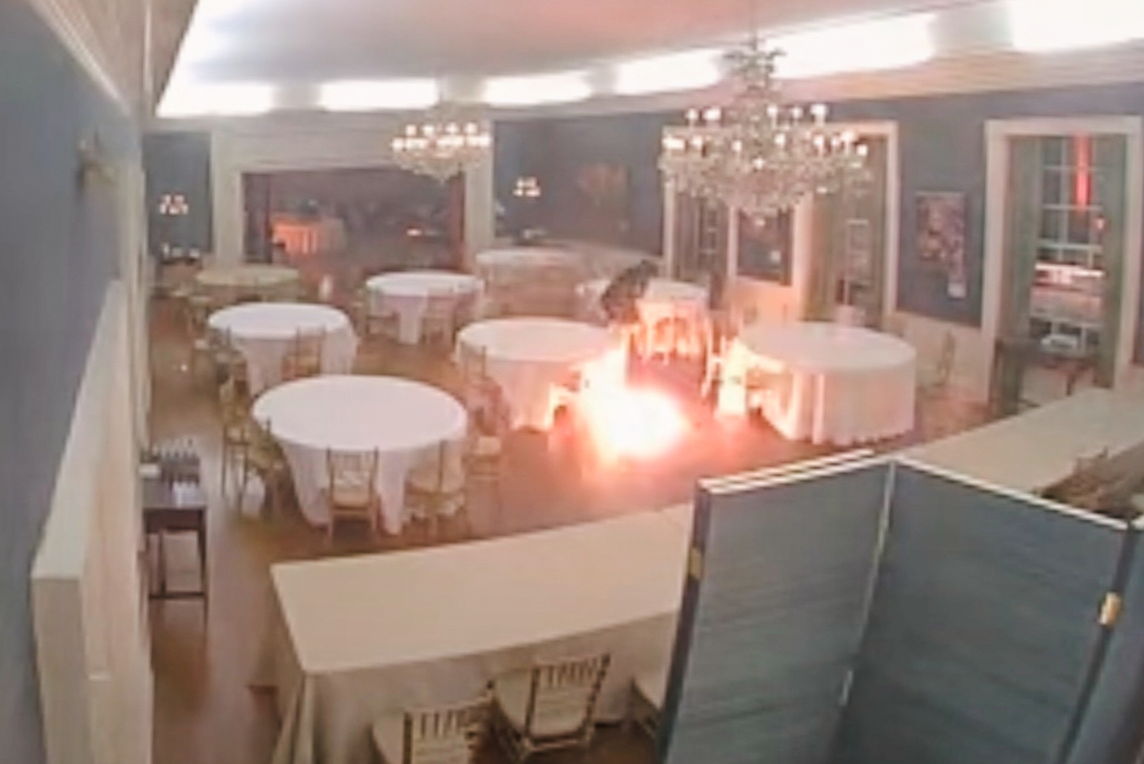 This image made from a surveillance video provided by the Dauphin County District Attorney's Office shows Cody Balmer throwing a Molotov cocktail in governor's mansion on April 13, 2025, in Harrisburg, Pa.