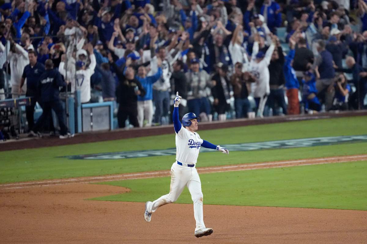 Los Angeles Dodgers’ Freddie Freeman celebrates his walk off home run during the 18th inning in Game 3 of baseball’s World Series against the Toronto Blue Jays, Monday, Oct. 27, 2025, in Los Angeles.
