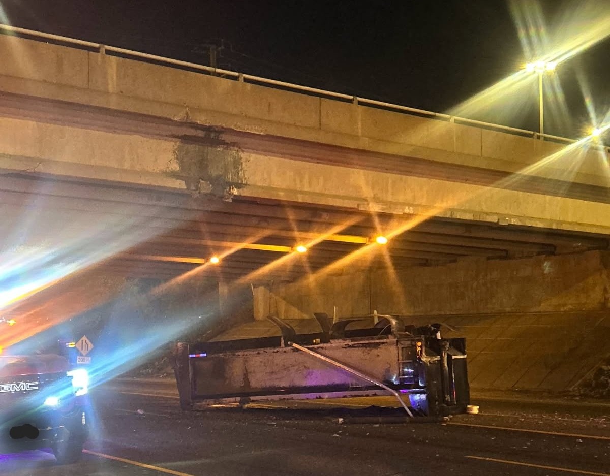 Image from the scene after a dump truck with its bin up collided into a Highway 400 overpass in Vaughan, Ont.