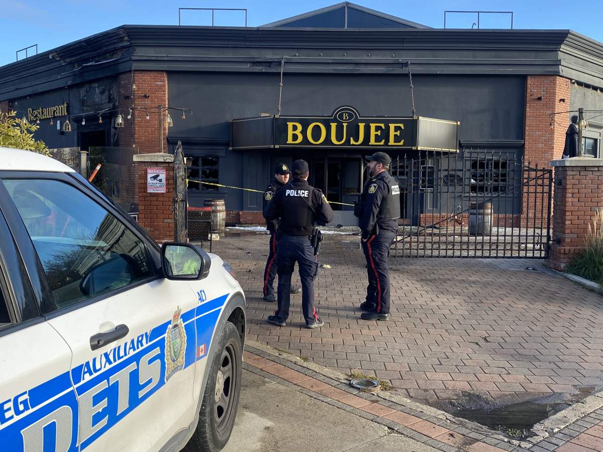 Winnipeg police at the scene of a fire at Boujee Restaurant and Bar Thursday.