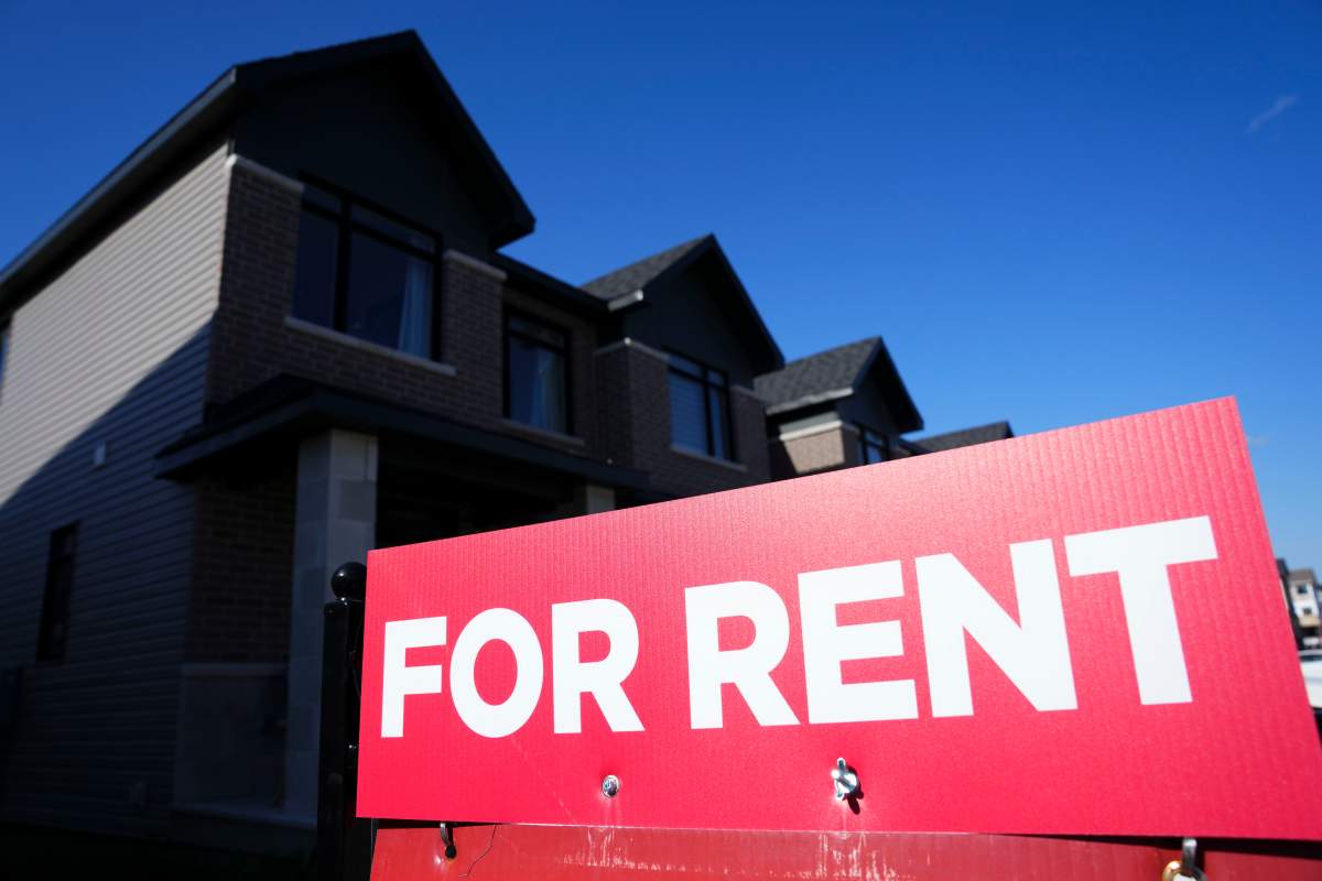 A "for rent" sign is displayed on a house in Ottawa on Friday, Oct. 14, 2022.
