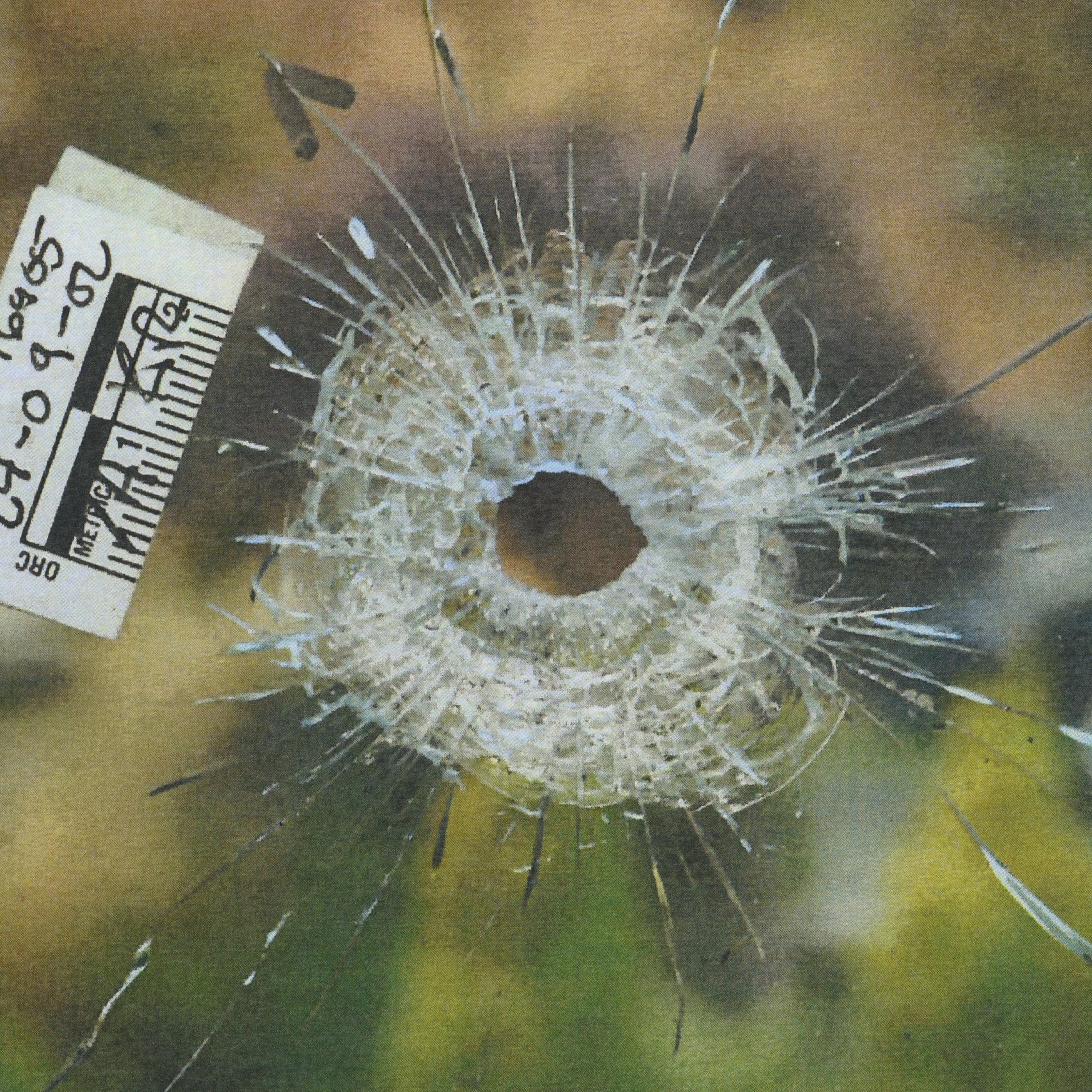 Crime scene photo shows bullet hole in window of home targeted by Bishnoi gang foot soldier Abjeet Kingra, Sept. 2, 2024.