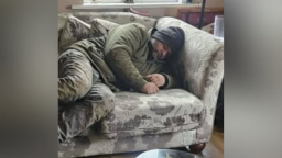 An AI generated image used to prank a person into believing an unhoused man was laying on their couch.