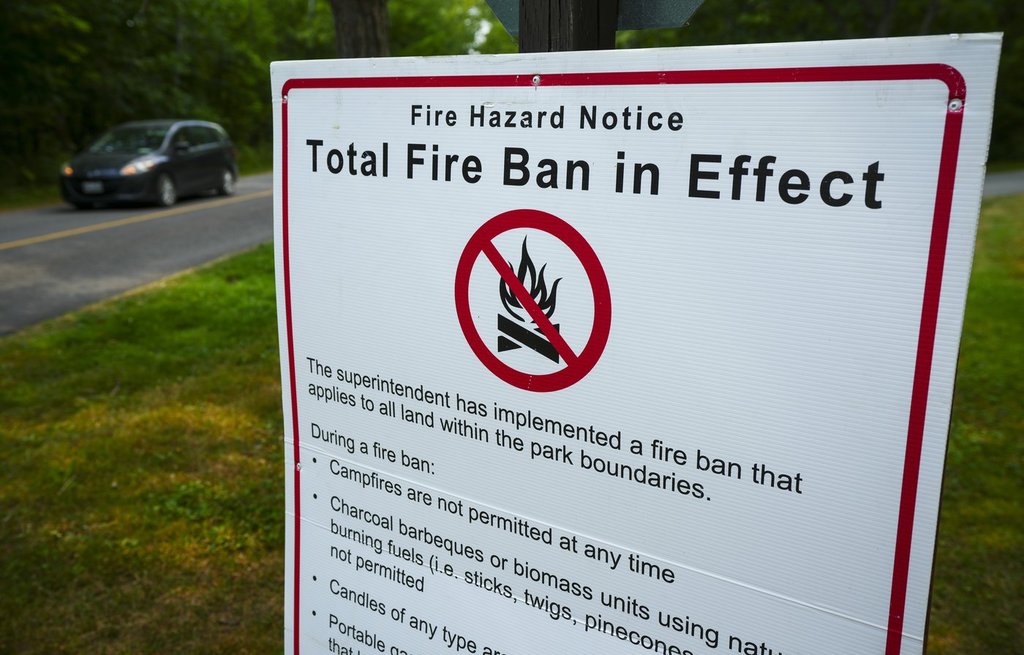 A fire ban sign is displayed at Fitzroy Provincial Park on the Ottawa River, in Fitzroy Harbour, Ont., Tuesday, Aug. 12, 2025. THE CANADIAN PRESS/Sean Kilpatrick.