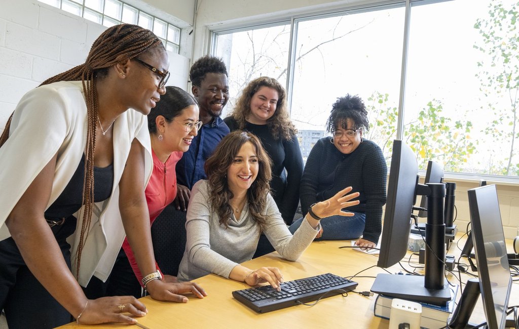 Fyscillia Ream, right, project manager of Reseau d'Assistance cyber-citoyen (RACC) from the IMC2 Institut, poses with her students from left to right, Josephine Sabze, Andrea Zeltzin Guadarrama Gaytan, Kamila Benamghar, Emmanuel Warren Songo-Kette, and Alice Carey after their cybersecurity debriefing at the offices of Institut du Nouveau Monde, a non-profit organization  in Montreal on Thursday, Oct. 23, 2025. THE CANADIAN PRESS/Christinne Muschi.