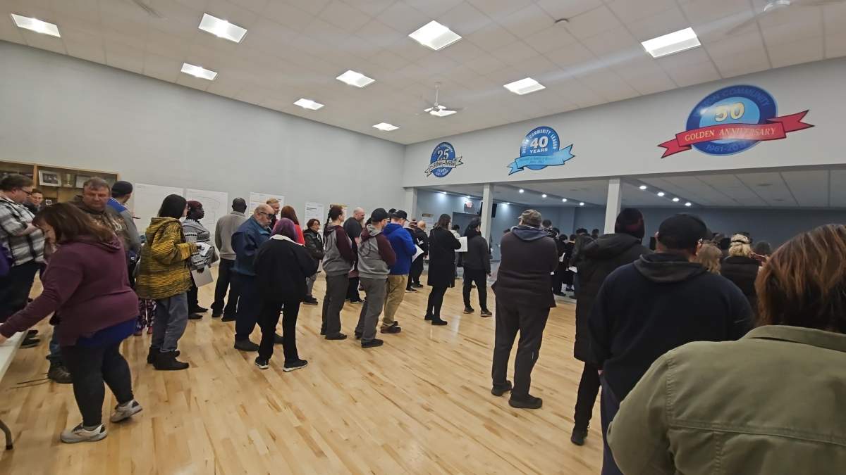 At this poll in the Edmonton neighbourhood of Delton, some voters told Global News the line hadn't moved for about 30 minutes.