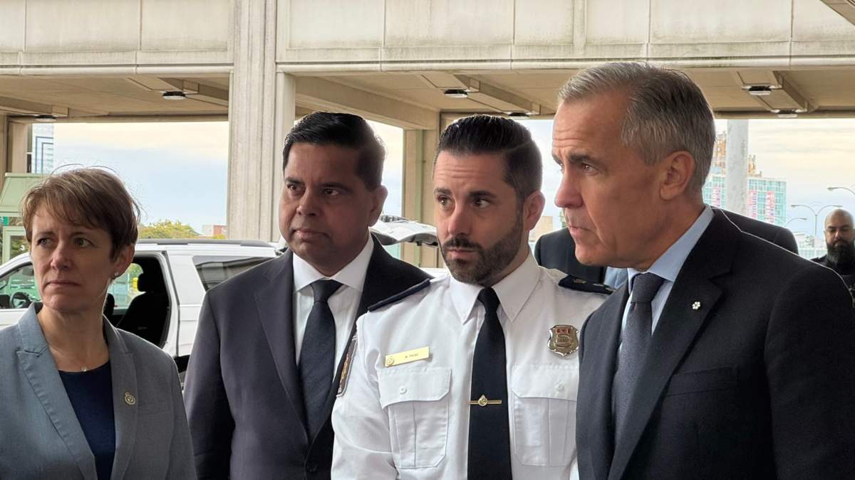 Public Safety Minister Gary Anandasangaree, second from left, with Prime Minister Mark Carney, at Rainbow Bridge border crossing, Oct. 17, 2025.