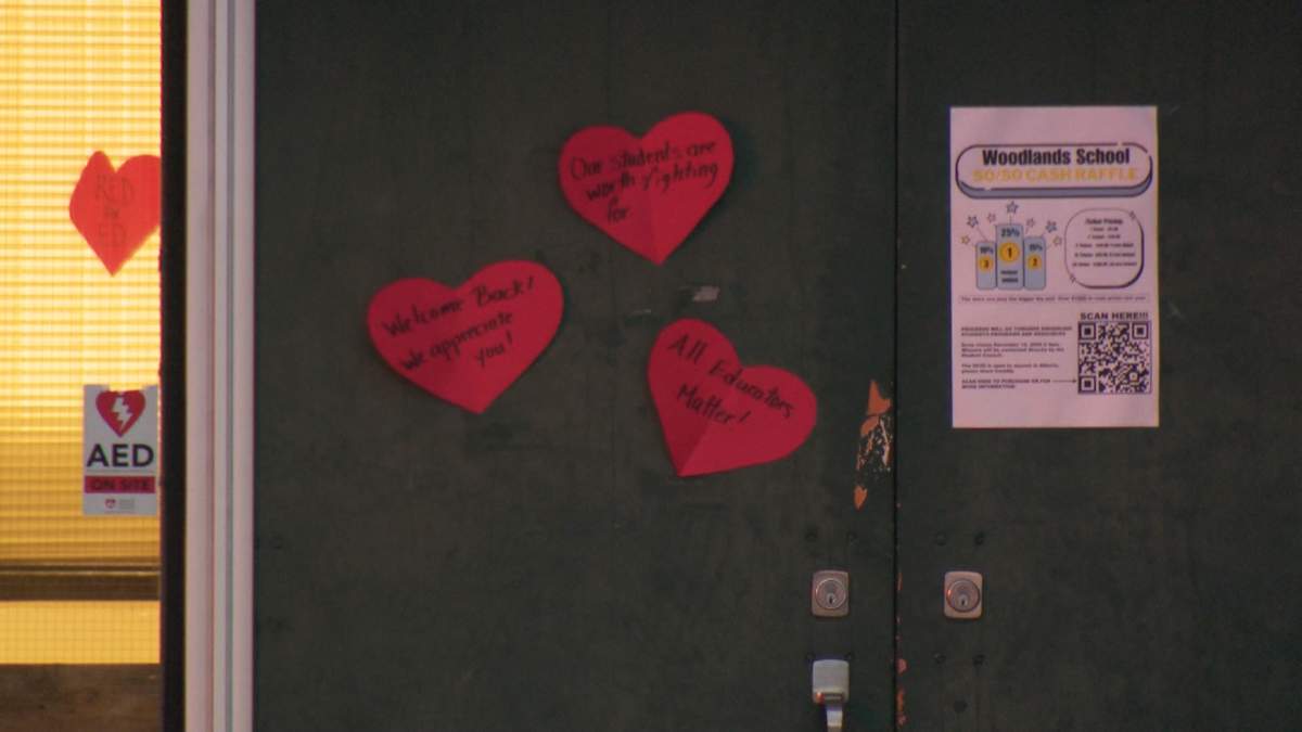 There were red hearts with messages of support for teachers adorning the doors of Woodlands School in Calgary as classes resumed Wednesday morning following a weeks-long strike.