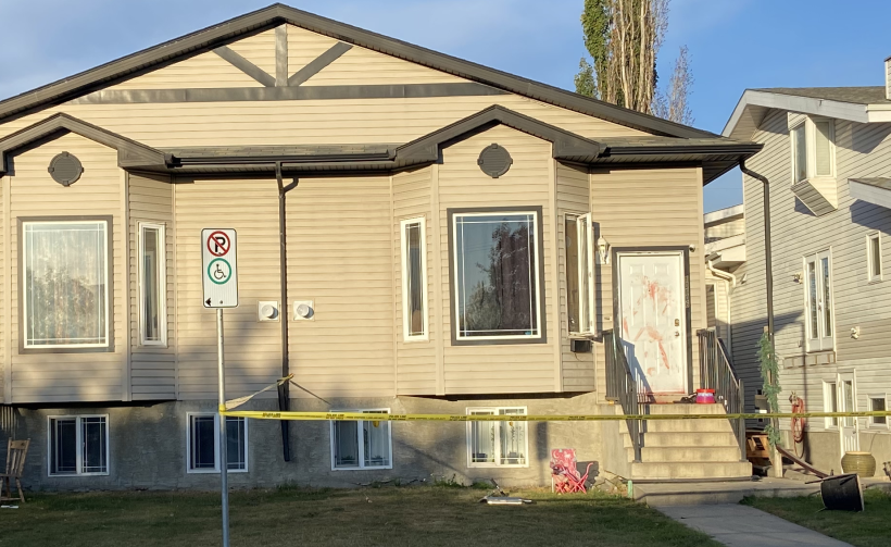 Police tape surrounded a home near 106 Avenue and 151 Street after two people were taken to the hospital following an assault.