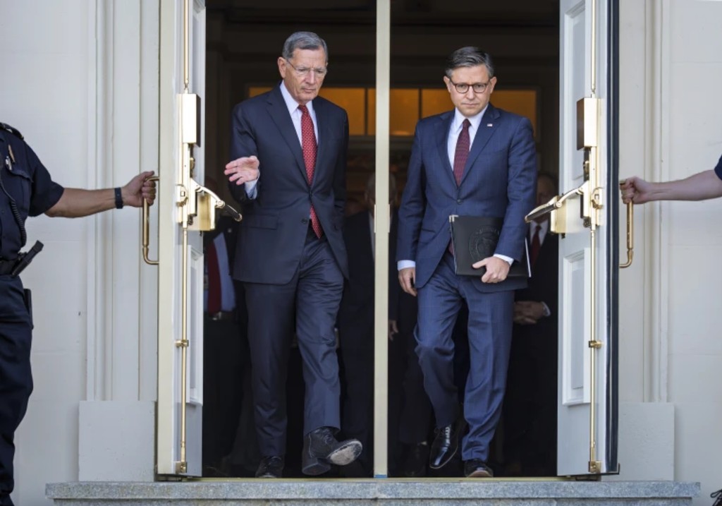 Sen. John Barrasso, R-Wyo., the Senate GOP whip, left, and Speaker of the House Mike Johnson, R-La., right, arrive for a news conference with top Republicans on the government shutdown, at the Capitol in Washington, Wednesday, Oct. 1, 2025.
