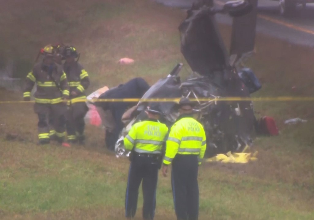This image made from video provided by WCVB-TV, shows the scene after a small plane crashed onto a highway in Dartmouth, Mass., Monday Oct. 13, 2025.