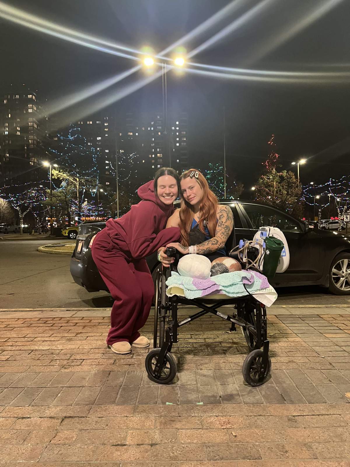 Raelyn Janssen and a friend outside the hospital.