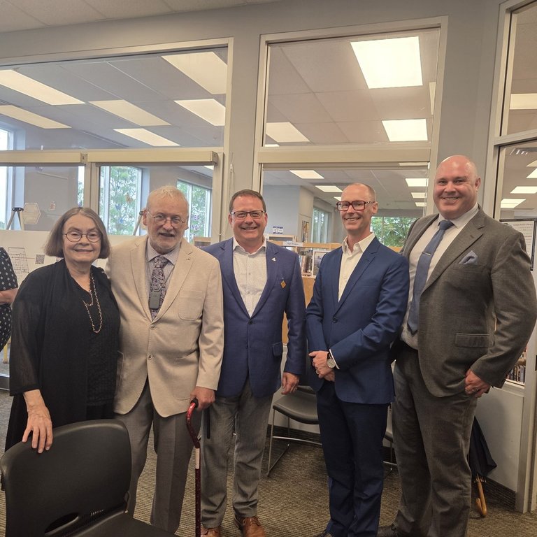 From left to right: Ann Munsch, author Robert Munsch, Guelph MPP Mike Schreiner, Guelph Public Library CEO Dan Atkins and GPL Chairperson Danny Williamson pose for a photo in Guelph, Ont., in a 2025 handout photo. Munsch is donating his stash of story drafts, publisher notes and fan letters to the Guelph Public Library. 