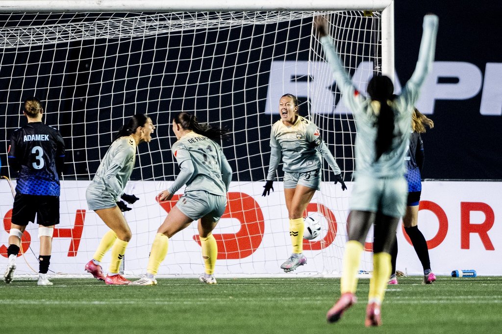 Vancouver Rise's Samantha Chang (8), centre right, jumps in celebration of her teammate Holly Ward's goal against the Ottawa Rapid during second half Northern Super League semifinal soccer action in Ottawa, on Saturday, Nov. 8, 2025. THE CANADIAN PRESS/Spencer Colby.