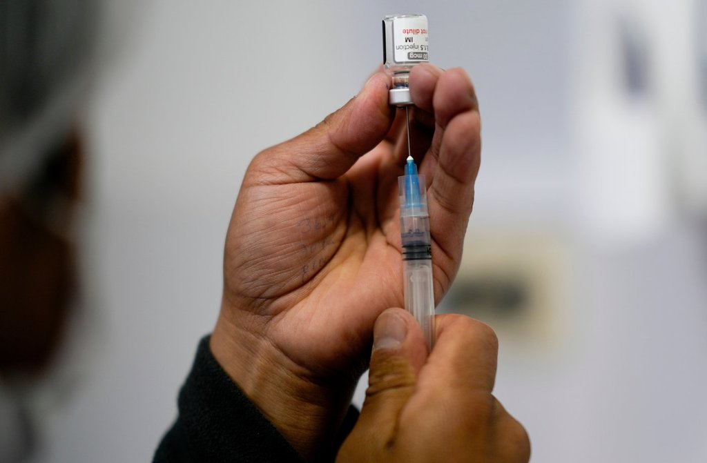 FILE - A healthcare worker prepares a shot of the Pfizer COVID-19 vaccine in La Paz, Bolivia, Jan. 7, 2025. (AP Photo/Juan Karita, File).