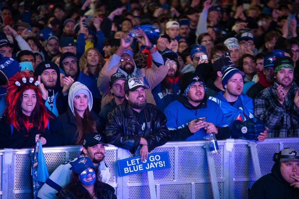People watch the Toronto Blue Jays play against the Los Angeles Dodgers at a World Series Game 6 watch party at Nathan Phillips Square in Toronto, on Friday, October 31, 2025.