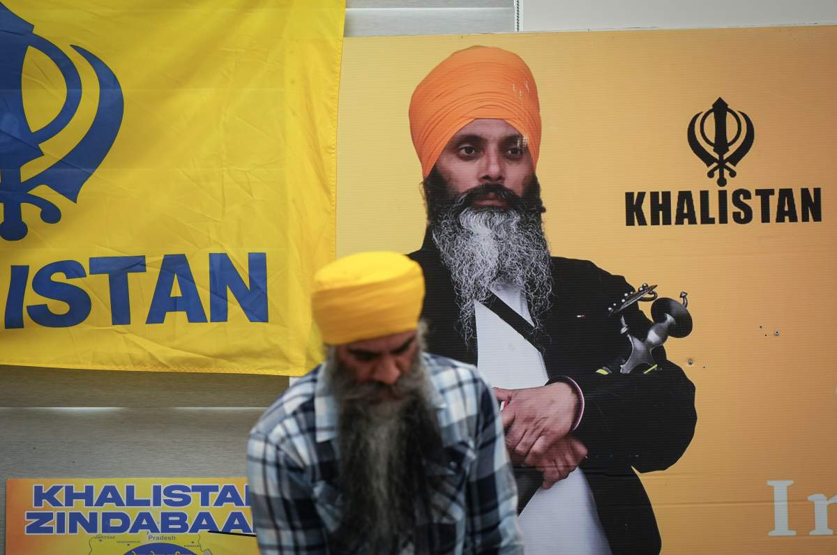 A photograph of late temple president Hardeep Singh Nijjar (right, on poster) at Guru Nanak Sikh Temple, Surrey, B.C., on Oct. 15, 2024. THE CANADIAN PRESS/Darryl Dyck