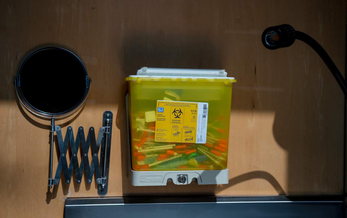 A sharps collector containing used needles sits on a wall in the consumption room at the Parkdale Queen West Community Health Centre in Toronto on March 21, 2025. The site was one of nine supervised drug consumption sites closed by the Ontario government earlier this year.