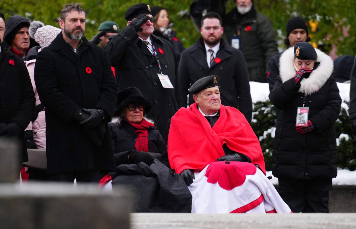 Second World War veteran John Preece, 99, sits with his wife during a Remembrance Day ceremony in Ottawa on Tuesday, Nov. 11, 2025.