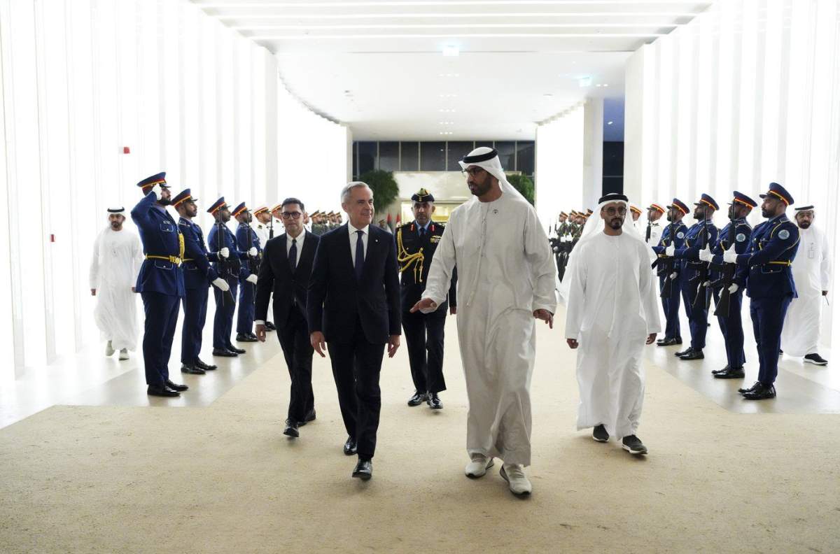 Prime Minister Mark Carney is welcomed by UAE Minister of Industry and Advanced Technology and managing director of state-run Abu Dhabi National Oil Co. (ADNOC) Sultan Ahmed al-Jaber, front right, as he arrives in Abu Dhabi on Wednesday, Nov. 19, 2025. THE CANADIAN PRESS/Sean Kilpatrick