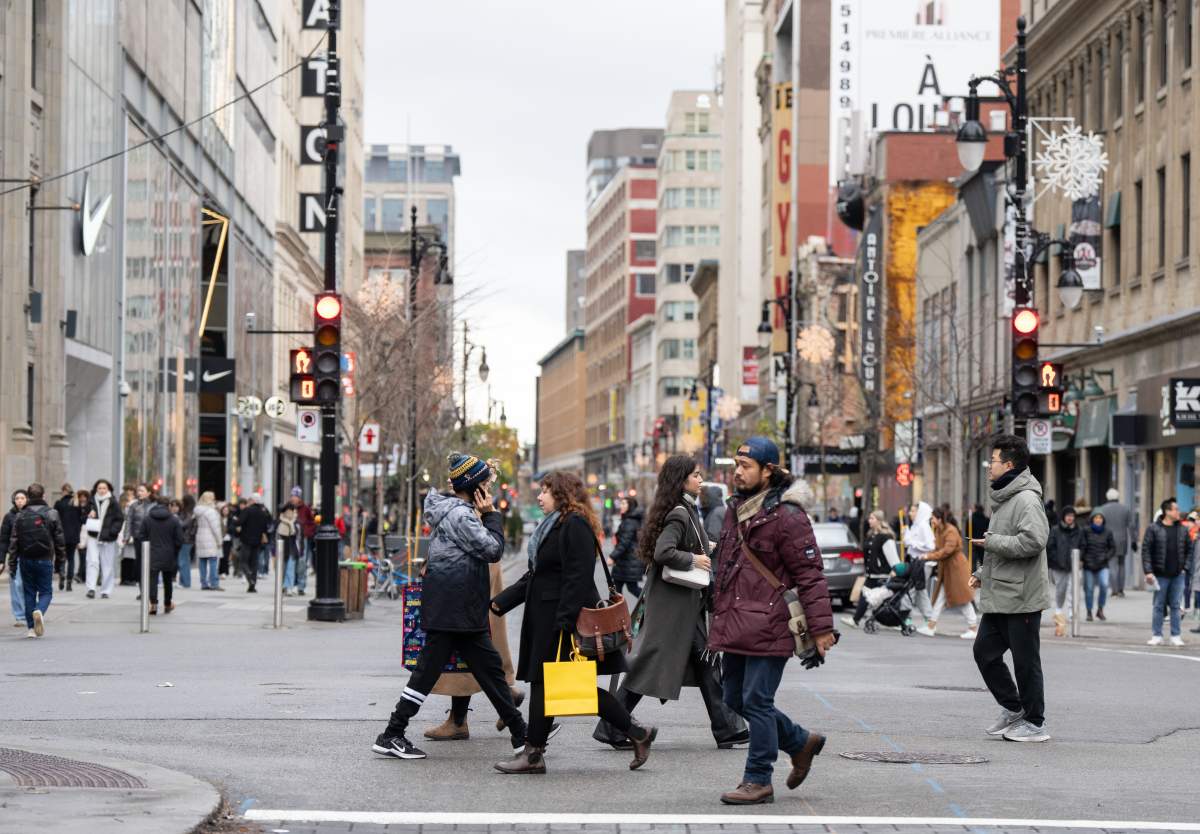 Shoppers on Sainte-Catherine St. take advantage of deals on Black Friday in Montreal, Friday, Nov. 29, 2024.