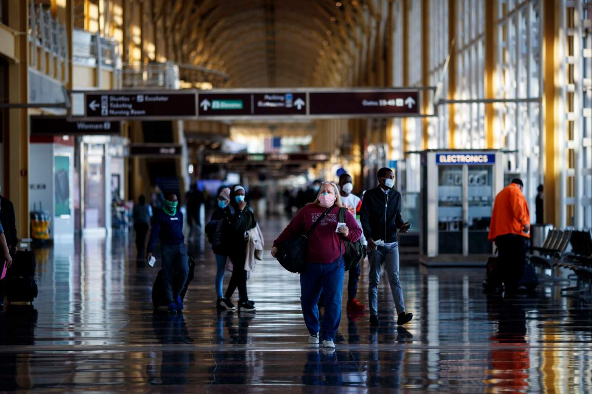 Travelers are seen at Regan National Airport in Arlington, Virginia, the United States, Nov. 24, 2020.