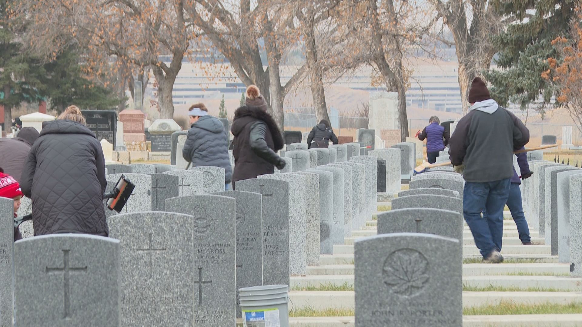 Volunteers clean veteran gravestones at Mountain View cemetery on Nov. 5, 2025.