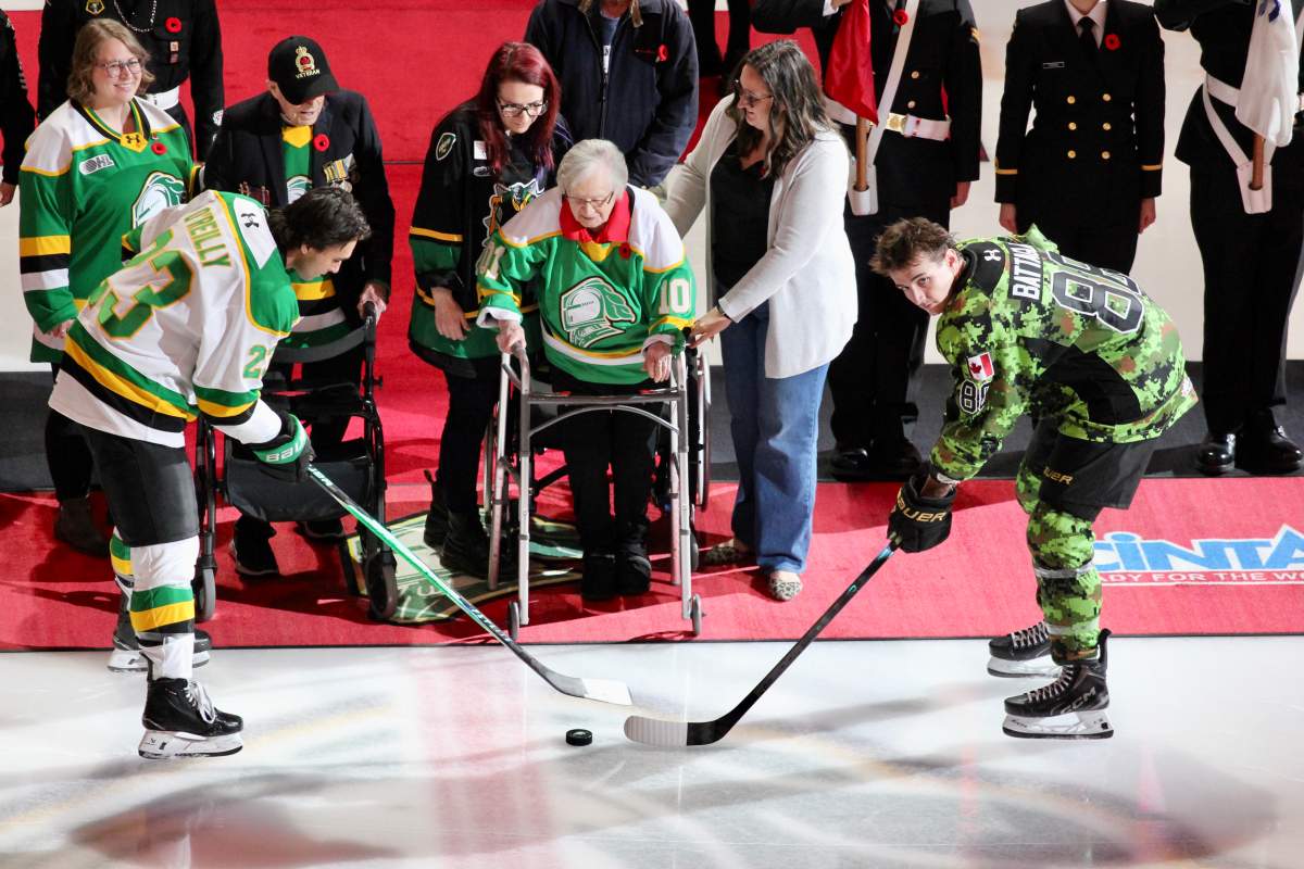 100 year old World War II veteran Sylvia O’Connell drops the puck before a game between the London Knights and the Kingston Frontenacs during the Knights annual Remembrance Day ceremony on Nov. 7, 2025 at Canada Life Place.